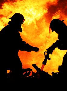 Firefighters battling a blazing fire
